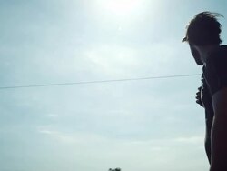Backpacker walking along road Stock Footage