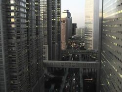 Elevated View of West Shinjuku Buildings in Tochou-dori Ave early Evening, Tokyo, Japan Stock Footage