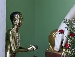 WS View of Golden statue wearing flower necklace praying to Buddha / Yangon, Yangon Division, Myanmar  Stock Footage