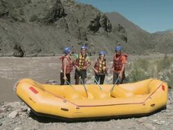 People ready for white water rafting, raising oars together Stock Footage