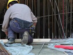 Construction Worker Marking Lumber on Construction Site Stock Footage