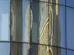 CU TU Glass Facade Mirroring St. Stephen's Cathedral (Stephansdom) in Vienna  Stock Footage