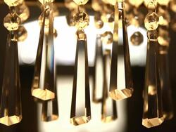 CU R/F Pretty crystals hanging from lit chandelier / Austin, Texas, United States  Stock Footage