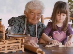 Cooking With Grandma-Beautiful Little Girl Learns How To Make Cookies  in The Bright-lit Vintage Kitchen Stock Footage