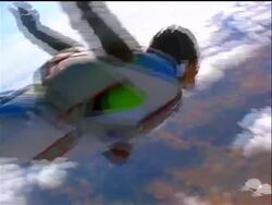 AERIAL PAN skydiver flying past camera toward clouds + farmland below / Sweden Stock Footage