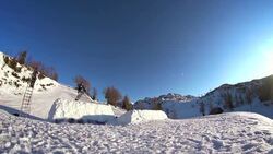 Snowboarder jumps over the camera Stock Footage