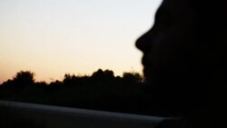 Traveler on the road watching the cars passing by Stock Footage