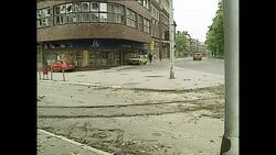 Siege of Sarajevo during Bosnian War - People running through deserted streets in Sarajevo News Clip
