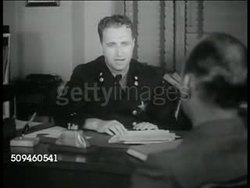 1938: EVANSTON, ILLINOIS: SAFETY DIVISION: Traffic policing & safety expert Franklin M. Kreml commenting on 'ticket fixing', saying safety & citation fixing don't mix, breaks down police moral. Instructional Video