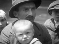 B/W 1900s close up PORTRAIT immigrant man in hat holding baby / NYC / newsreel Stock Footage