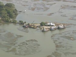 MS AERIAL Shot of Shrimp boats at dock in Sapelo Sound / Georgia, United States Stock Footage