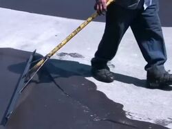 (HD1080i) Road Construction / Resealing, Spreading Tar Mixture Stock Footage