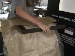 Woman hangs Picasso artwork on wall News Clip