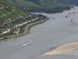 WS Boats traveling on river near town / Lorchhausen, Rhineland-Palatinate, Germany  Stock Footage