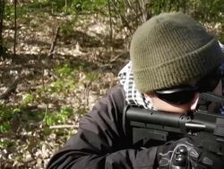 Operator/Terrorist aiming an assault rifle Stock Footage