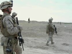 February 2009 WS PAN Group of soldiers over field / Bakwa, Farah Province, Afghanistan Stock Footage
