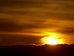 WS T/L Clouds moving across sky, sun sets in horizon / Big Sur, California, United States Stock Footage