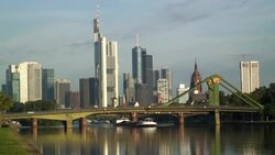 Traffic travels over a bridge on the Rhine River in Frankfurt. Stock Footage