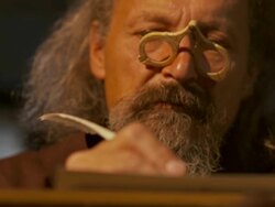 HD DOLLY: Monk Carefully Scribing Calligraphy Text Stock Footage