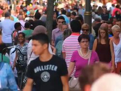 Multi-ethnic people walking through the city streets Stock Footage