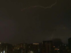 Large bolt of lightning streaks across the night sky, Hong Kong Stock Footage