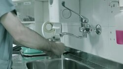 Doctor washes his hands before surgery Stock Footage