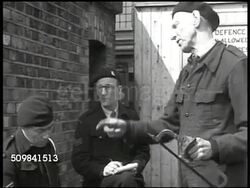 1945: ENGLAND AIR WARDENS: DRAMATIZATION: EXT British air wardens sitting, talking against brick wall. '... if we get all the things the government's promised, I think we'd be okay, don't you?' 'If we get it.' 'Oh they promised it!' Instructional Video