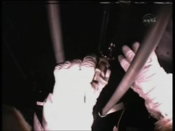 Astronauts struggle to repair the Hubble science instrument News Clip