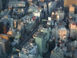 High elevation view of Tokyo city showing modes of transport using Lensbaby, Japan, Asia Stock Footage