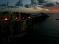 Vieste town sunrise built on famous point called Pizzomunno a vertical rocky monolith, Promontorio Del Gargano, Puglia, Italy, Europe, Time lapse Stock Footage