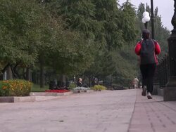 WS waterfront jogger Stock Footage