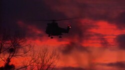 Helicopter Flying In Front Of Sunset After Siege News Clip