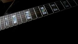 Electric Guitar On Black Background. Tracking Shot Stock Footage