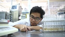 Young Asian men scientist sleep in laboratory Stock Footage