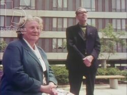 Living at Thamesmead, 1973, part 9 - Young couple talking to senior citizens, and new construction site Stock Footage
