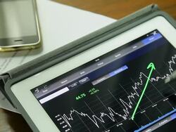 Businessman using Tablet analysis stock data. Stock Footage