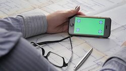 Architect's Hands and Touch Screen Over a Blueprints Stock Footage