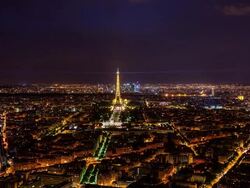 High view on Eiffel Tower and La Defense at night Stock Footage