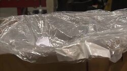 Workers in metal powder factory packing plant News Clip