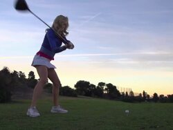 A woman playing golf. - Super Slow Motion - filmed at 240 fps Stock Footage