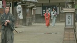 People wear traditional Japanese clothing walking in Japanese retro town. Stock Footage
