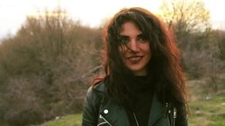 Smiling young cute brunette enjoying the day in nature Stock Footage