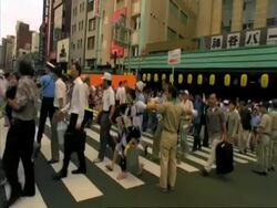 MS crowds in Tokyo Asakusa district crossing road, Tokyo, Japan Stock Footage