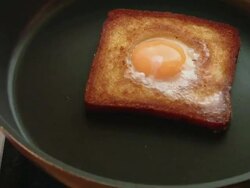 CU PAN Hand making Egg in Nest in pan Stock Footage