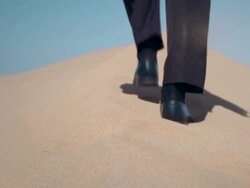 Businessman in desert Stock Footage