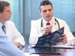 Doctors Review and Discuss Radiology Slides Stock Footage