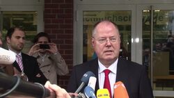 Centre-left Social Democrats leader Peer Steinbrueck votes, voting in rural areas, vox pops Instructional Video