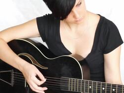 Beatiful girl playing acoustic guitar. Stock Footage
