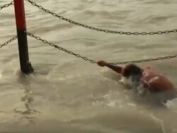 Senior man bathing in a river, Ganges River, Haridwar, Uttarakhand, India Stock Footage