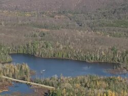 WS AERIAL ZI PAN Small river floaing through Adirondacks park / New York, United States Stock Footage